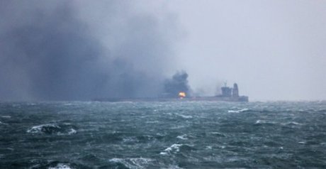 Body found, tanker still on fire after sea collision Body found, tanker still on fire after sea collision